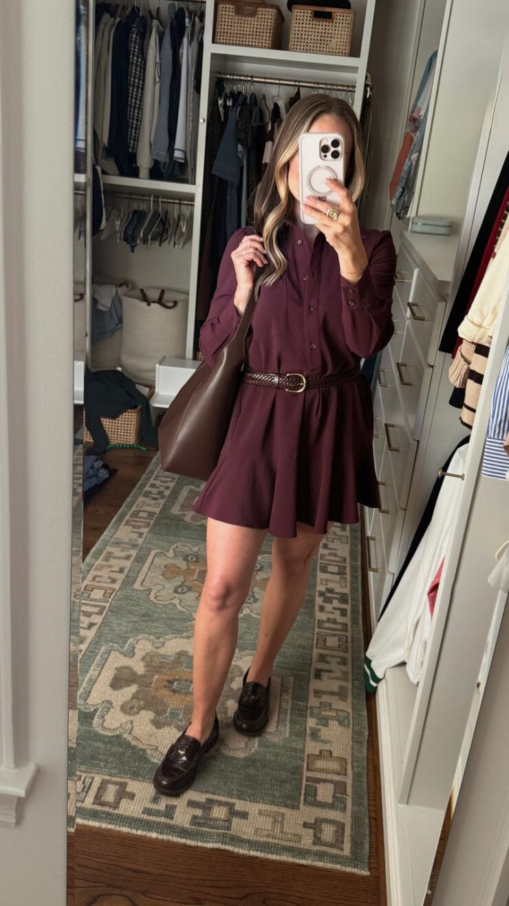 TeriLyn Adams wearing a burgundy belted shirt dress with a brown shoulder bag and loafers