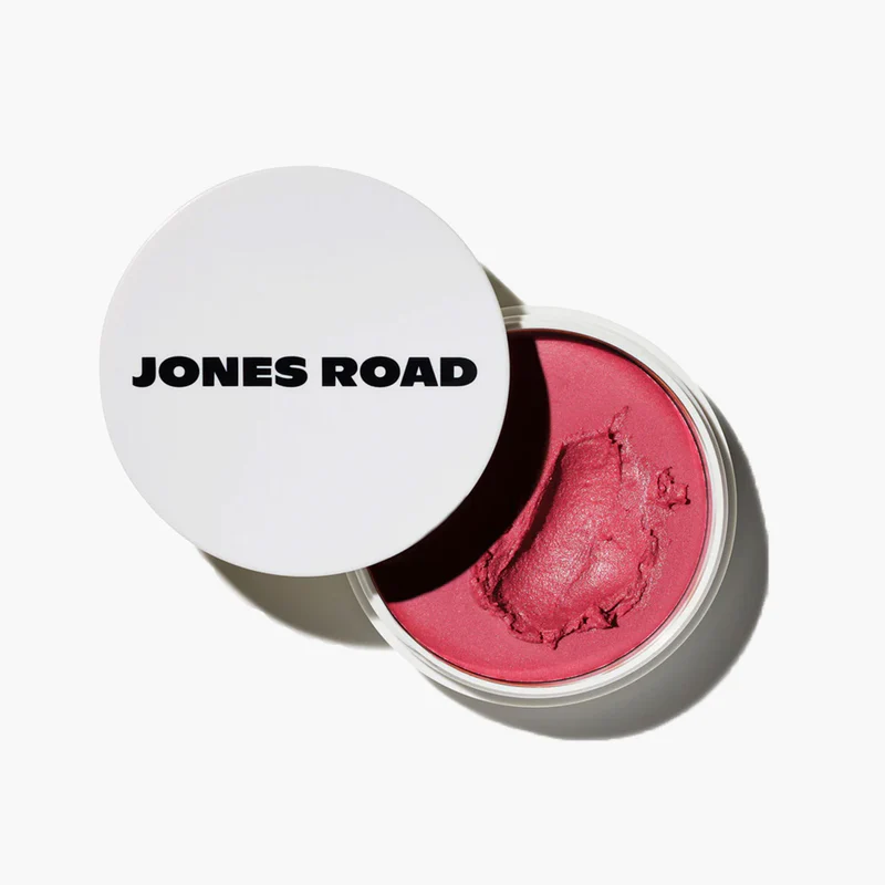Jones Road Miracle Balm open jar showing a berry-pink cream blush