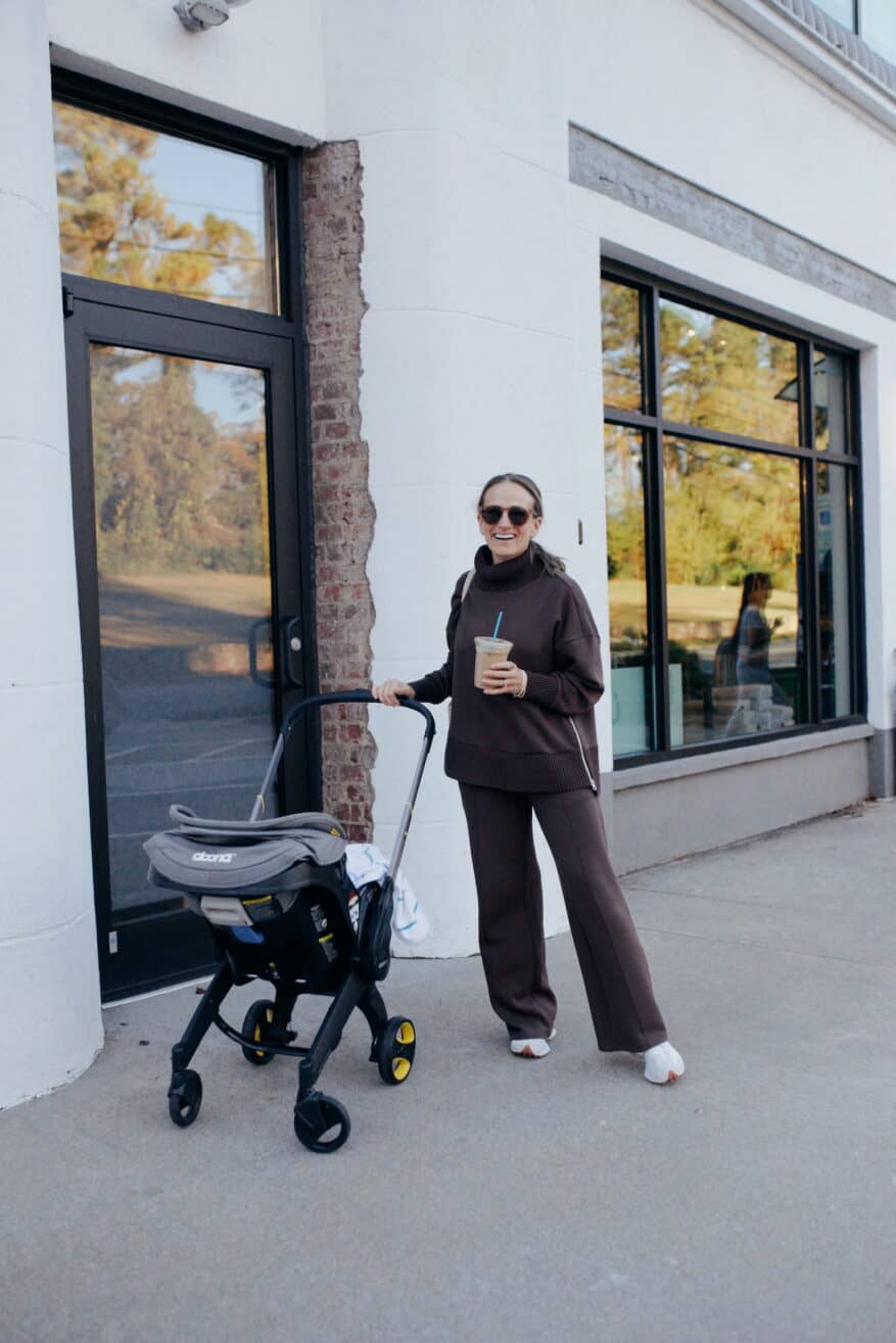 Woman pushing stroller in athleisure