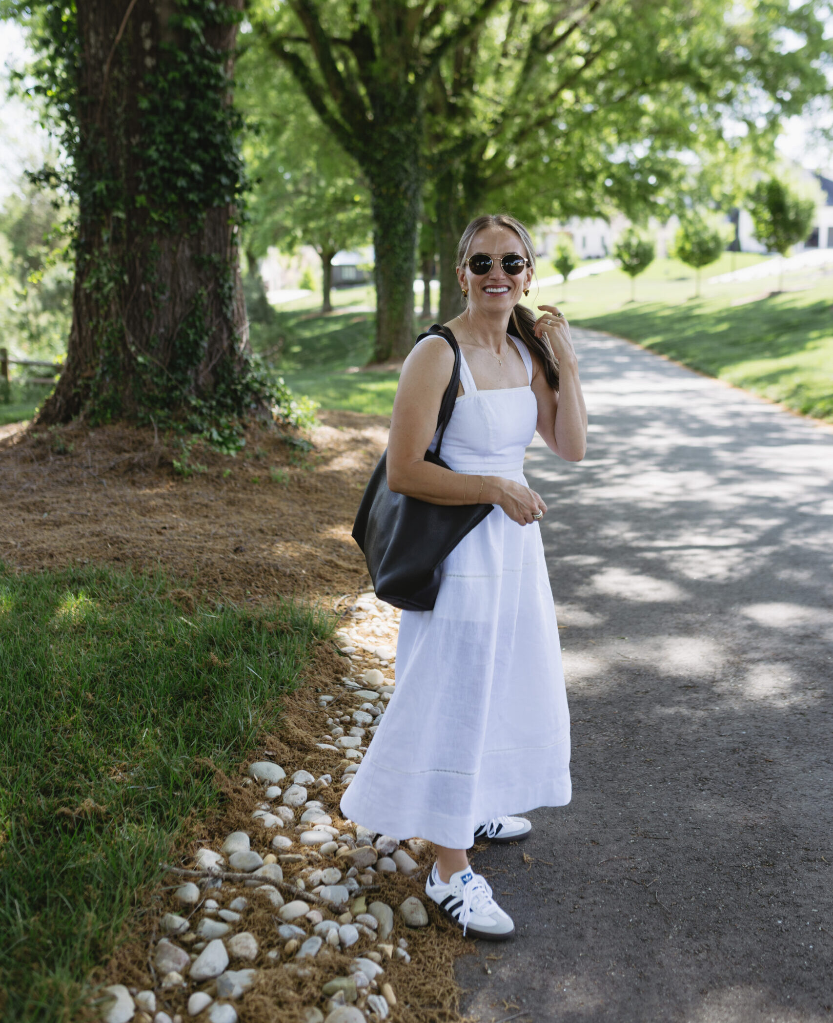TeriLyn Adams wearing the Everett Linen Dress with Adidas Samba OG Sneakers and a Sera-Black shoulder bag