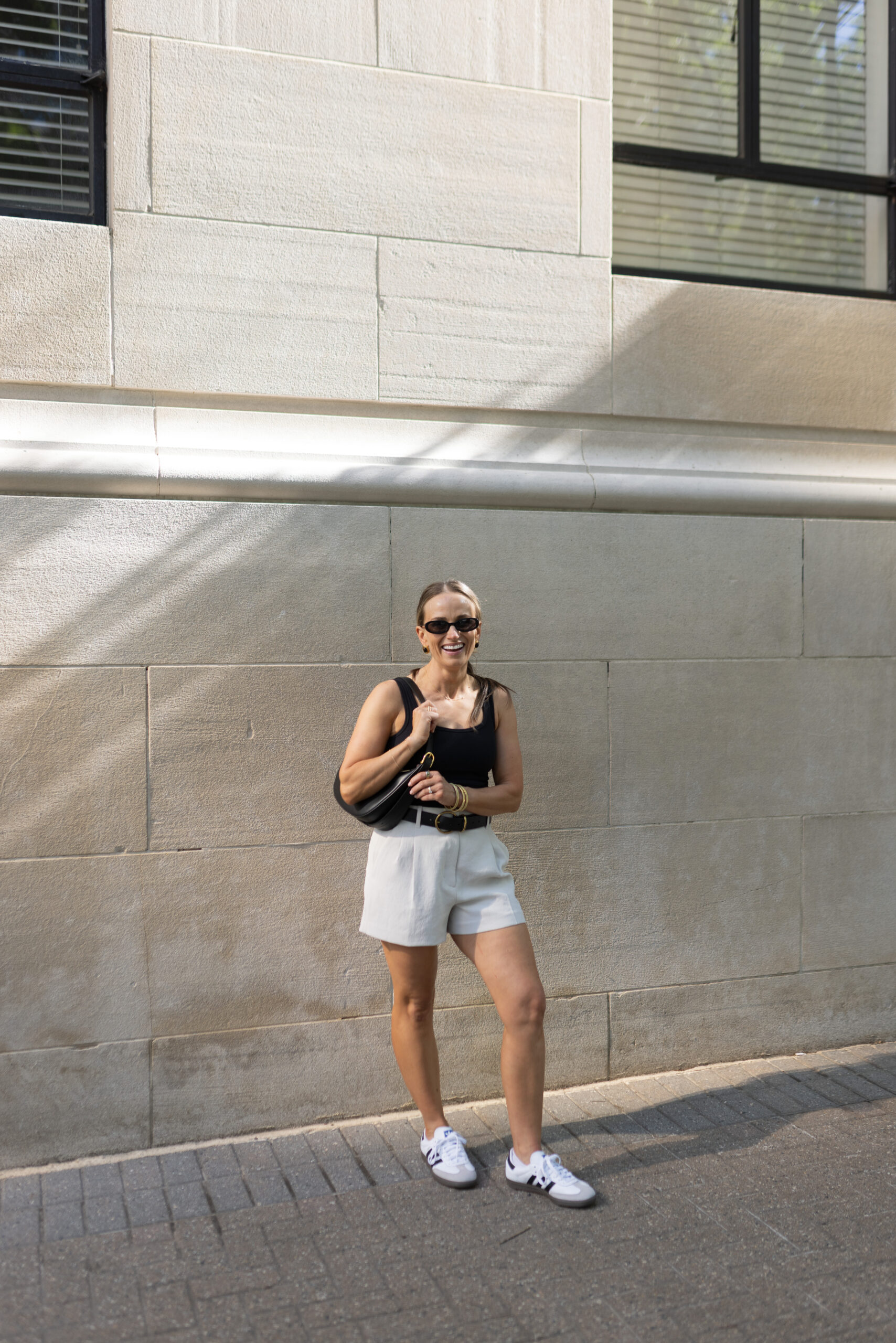 TeriLyn Adams in the Abercrombie Bra-Free Rib Scoopneck Tank and Trouser Shorts carrying a Sera-Black bag