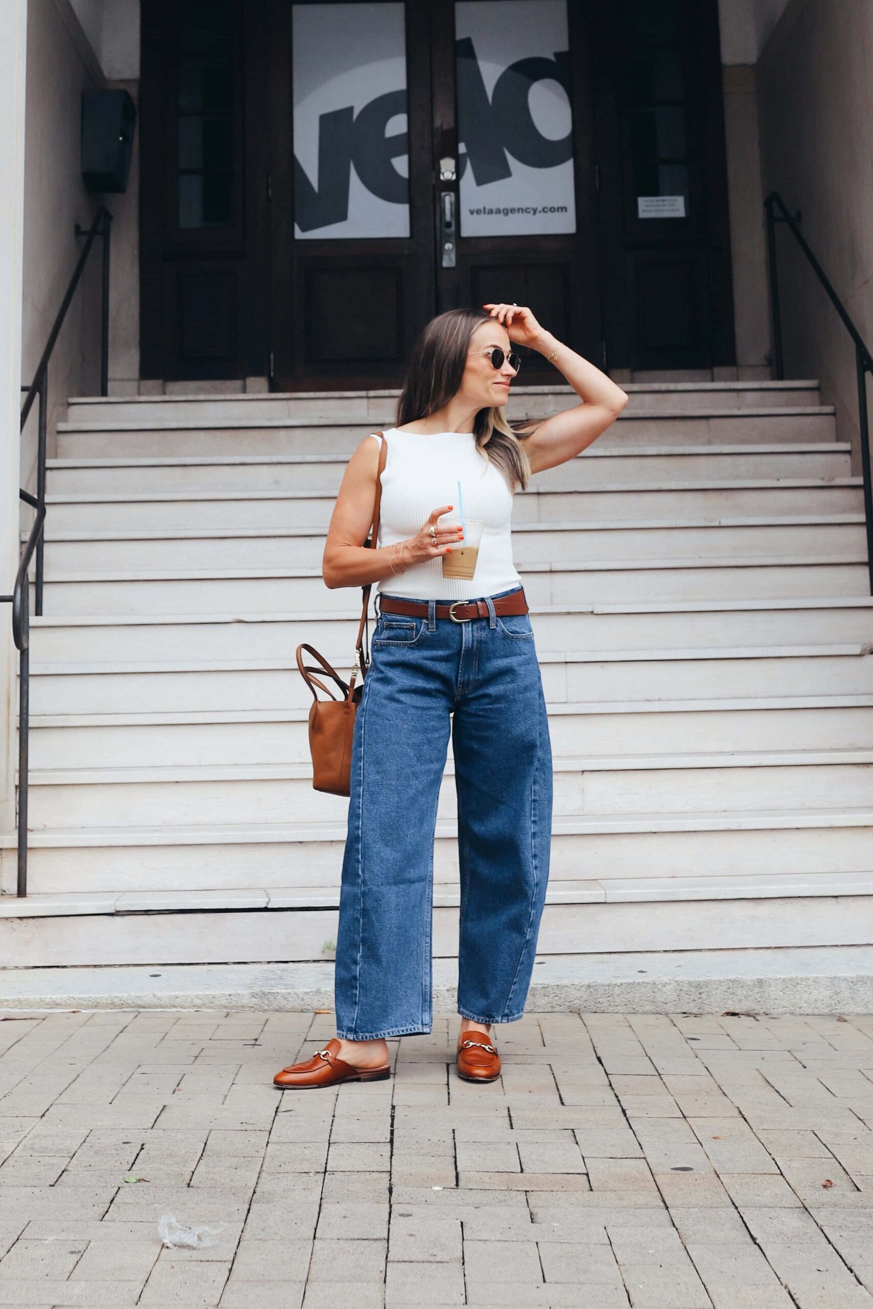 woman walking in abercrombie barrel jeans