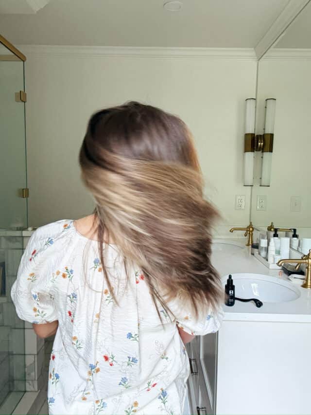 Woman shaking her head with hair in her face