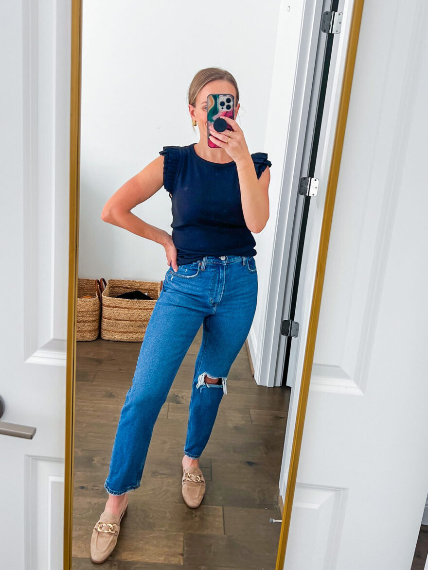 woman showing the front details of the Abercrombie and Fitch Ultra High-Rise Ankle Straight Jean