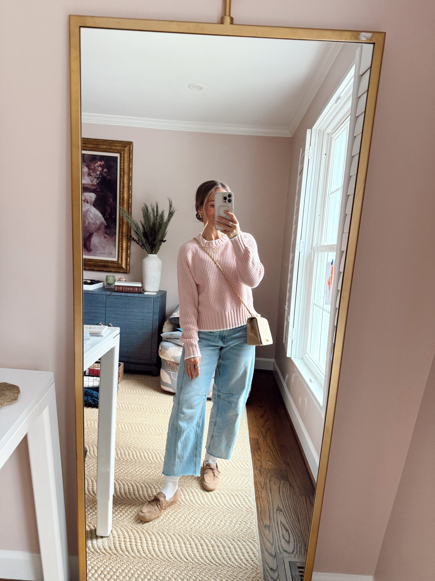 TeriLyn Adams wearing a pink sweater with Loft barrel jeans and tan loafers