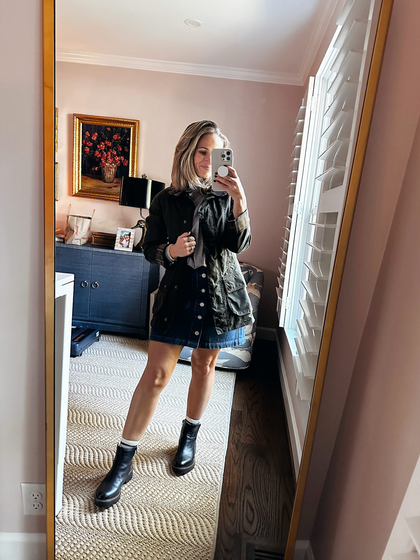 Woman pairing denim skirt with Chelsea Boot