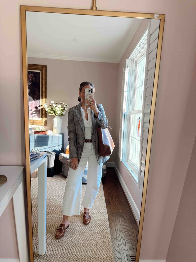 TeriLyn Adams wearing a plaid blazer, white jeans, and cognac Serena loafers