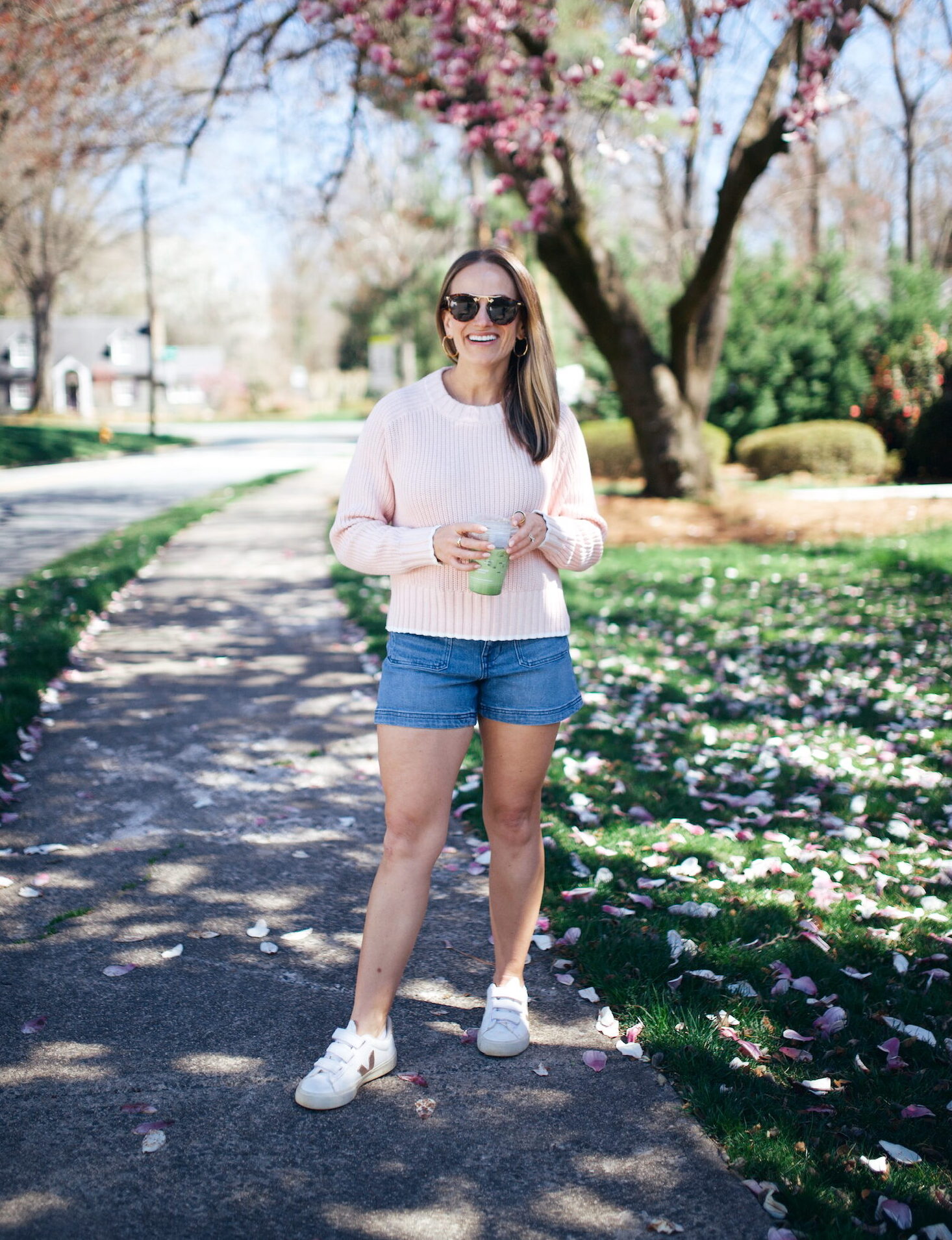 TeriLyn Adams wearing Madewll Emmy jean shorts with white sneakers