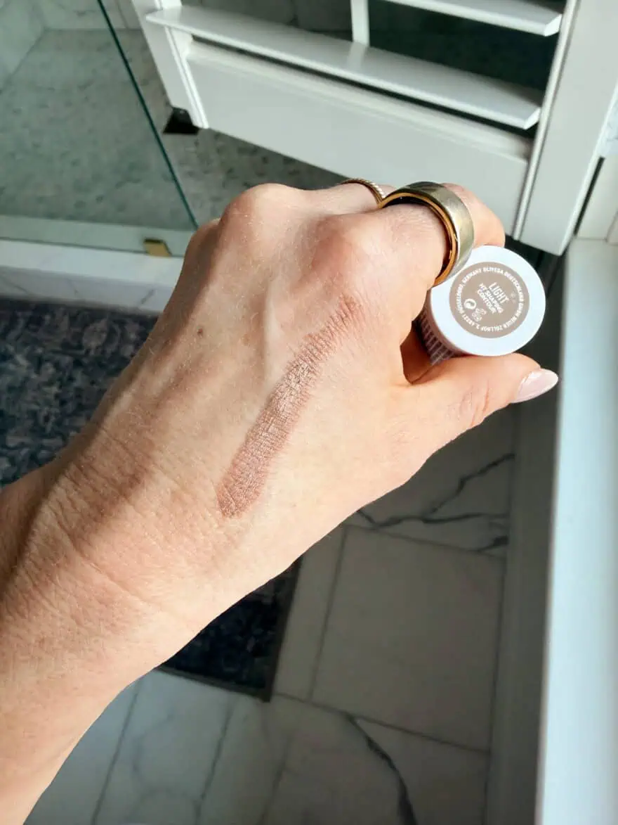 Woman showing HT Shaping Contour on skin