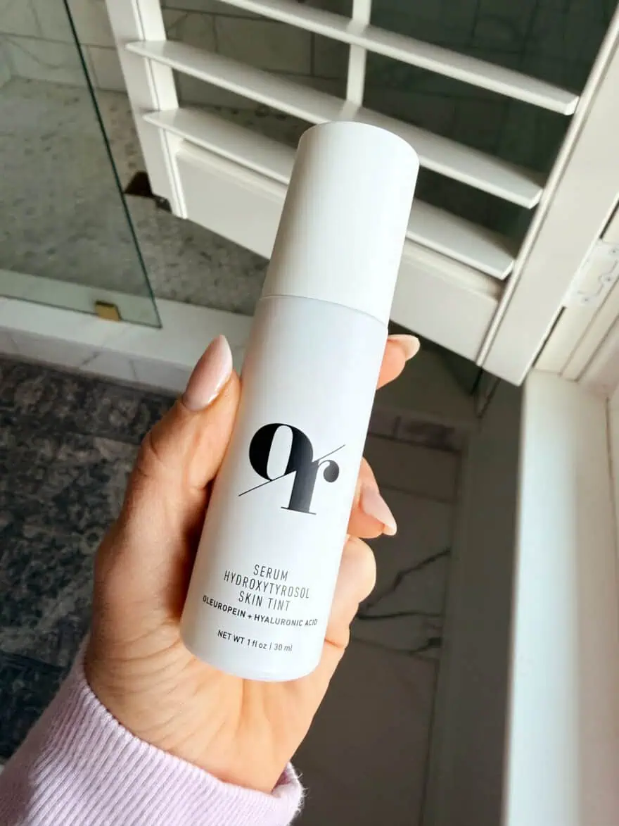 Woman holding Olive Rose skin tint