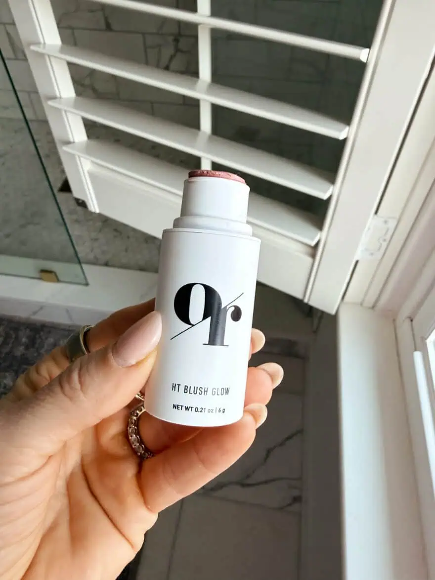 Woman holding HT Blush Glow