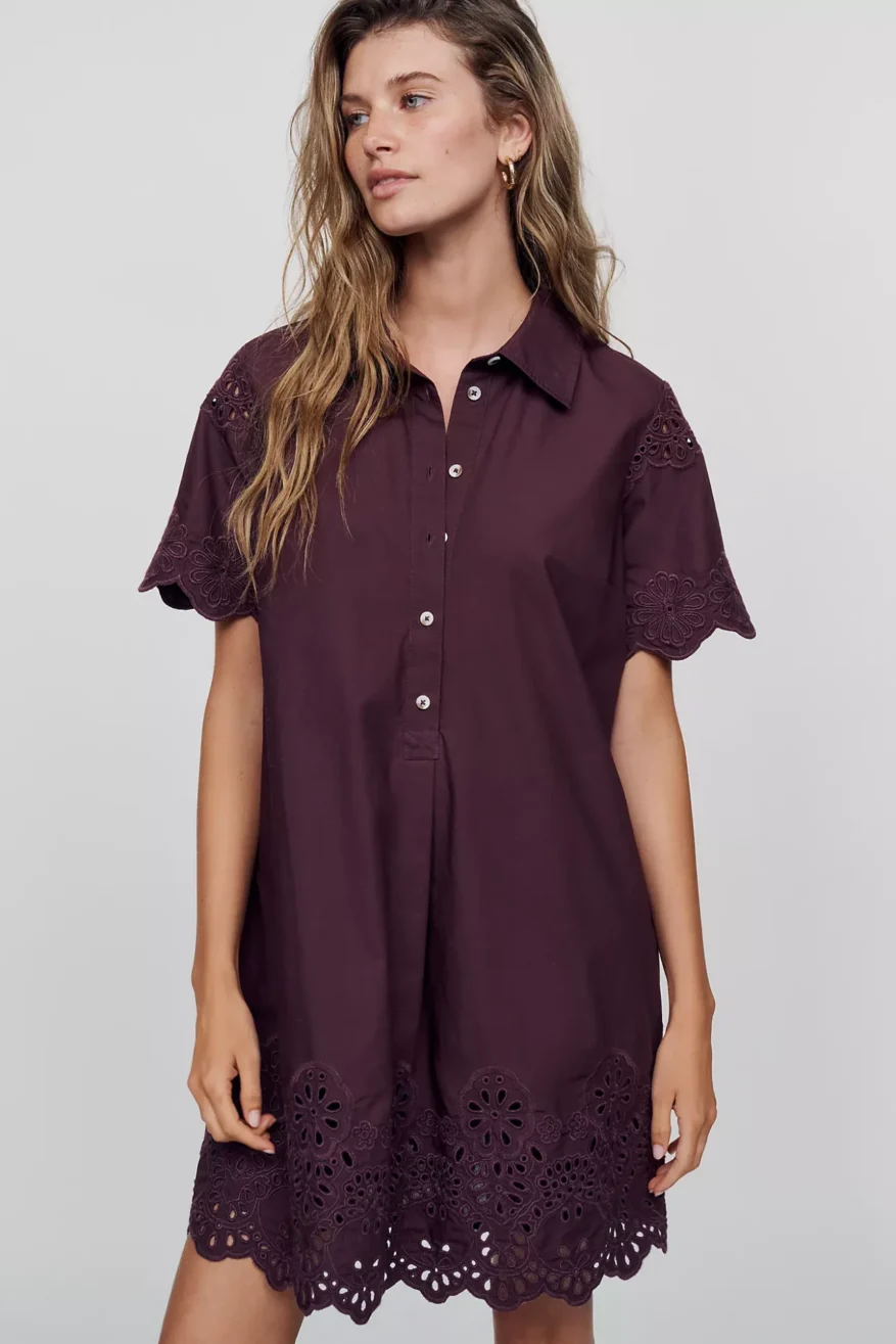 Anthropologie Swing Dress in plum with eyelet trim worn by a model