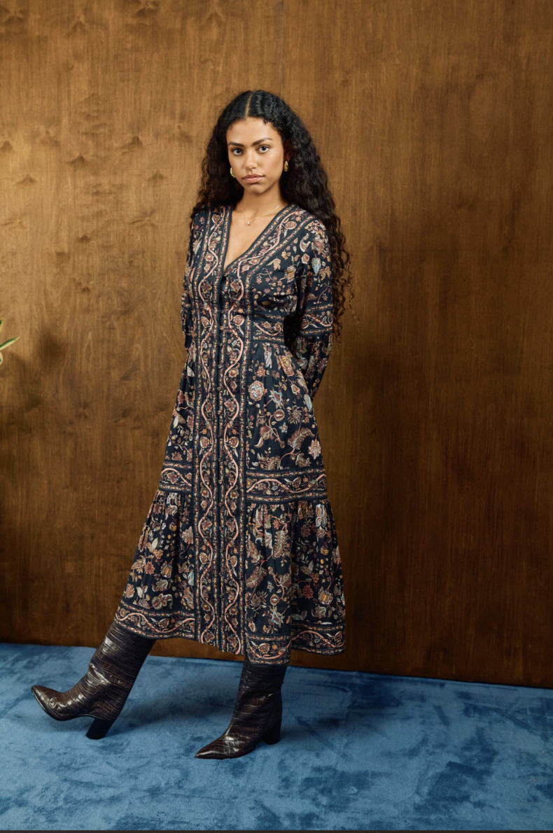 Cleobella Melody Midi Dress in a dark floral print worn by a model