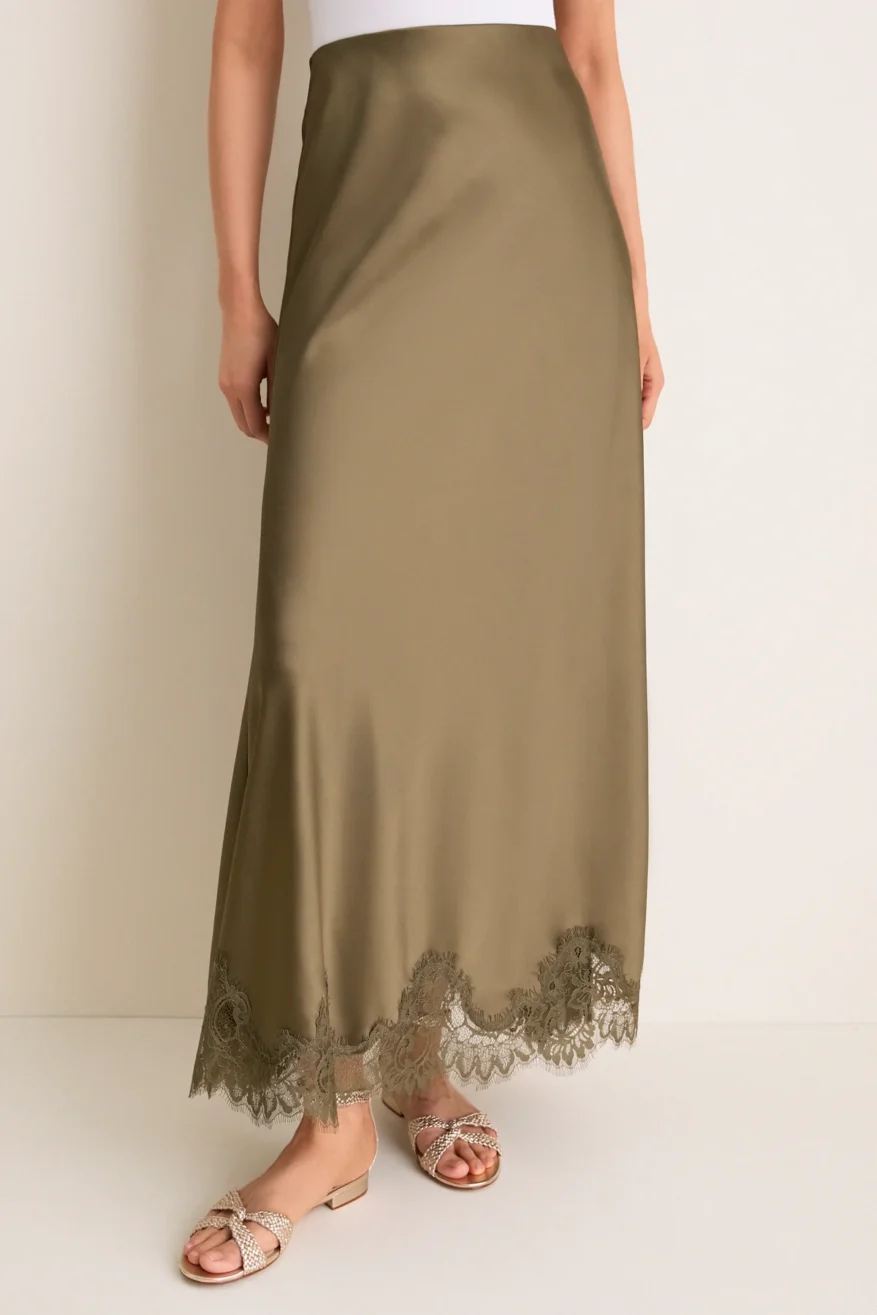 Tuckernuck Satin Mischa Slip Skirt in olive worn by a model