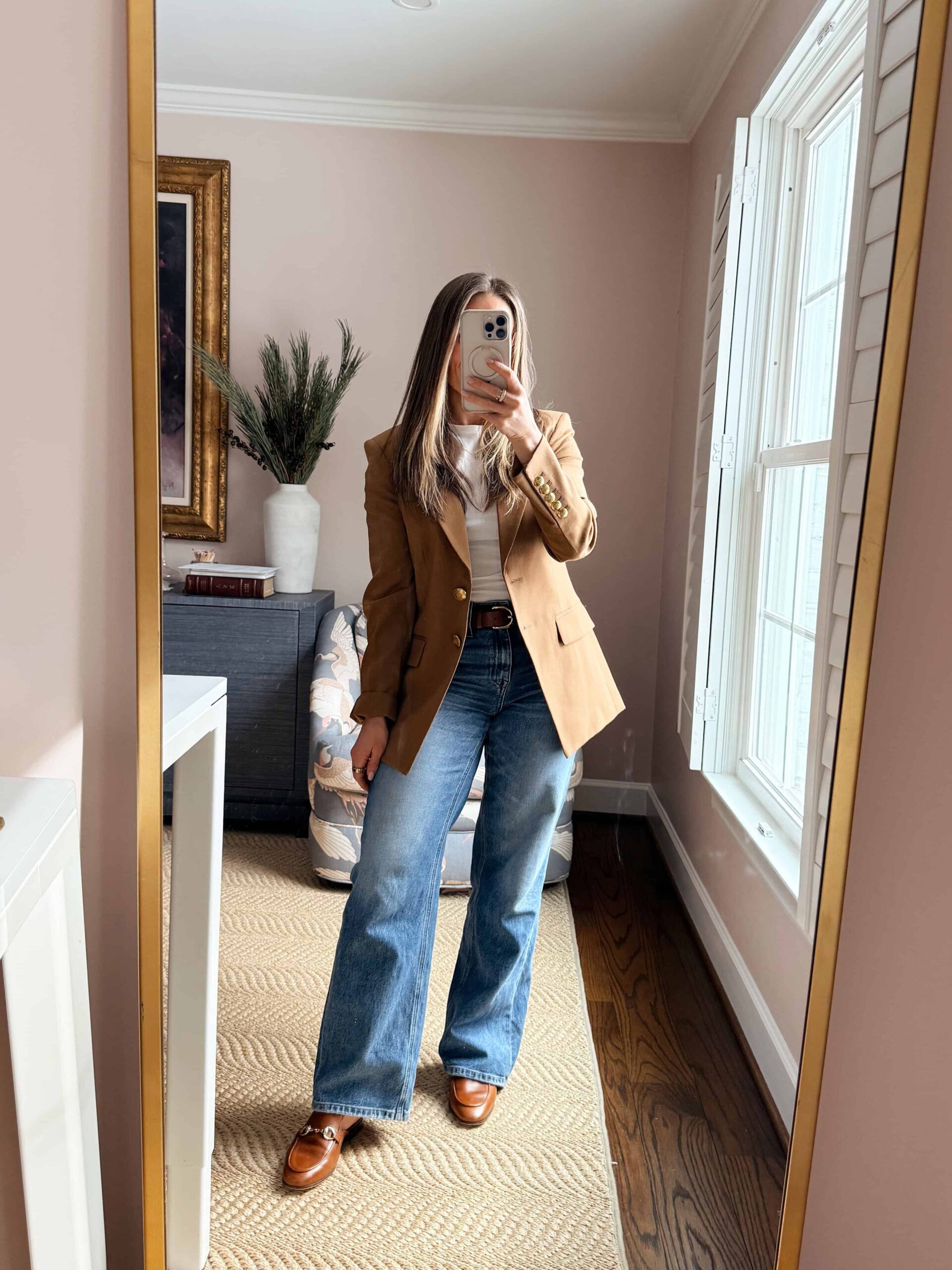 Woman wearing wide-leg jeans with tailored blazer