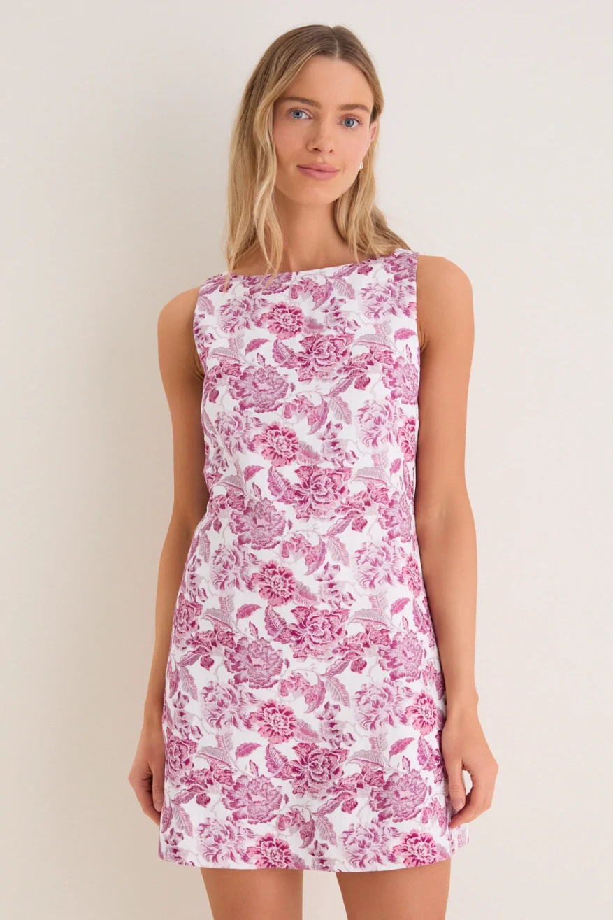 Woman wearing the English Factory Rosewood Floral Leo mini dress with a pink floral print