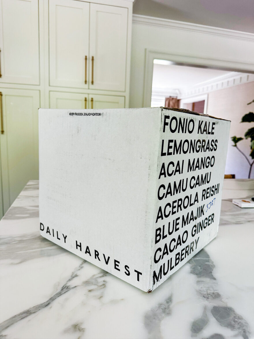 Daily Harvest smoothie box on kitchen counter, easy frozen meal delivery for new moms.