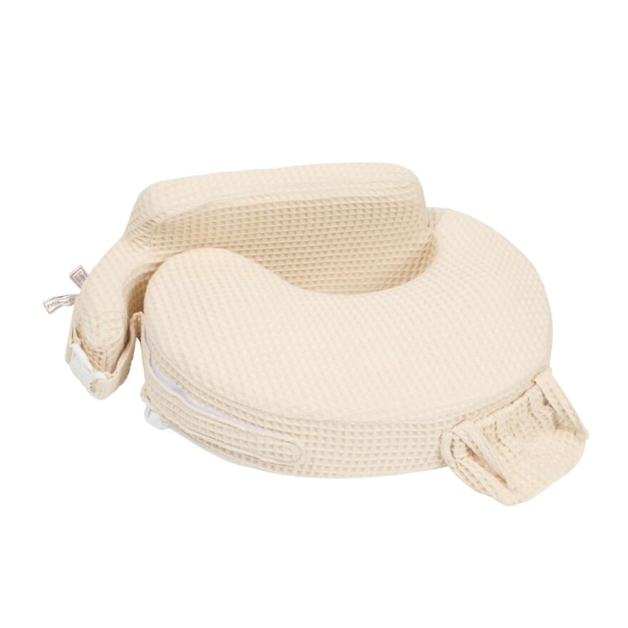 My Brest Friend nursing pillow in cream waffle fabric with adjustable strap, product shot.