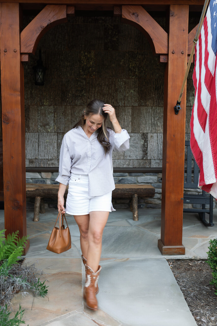 Terilyn adams wearing white jean shorts with button up top and cowboy boots