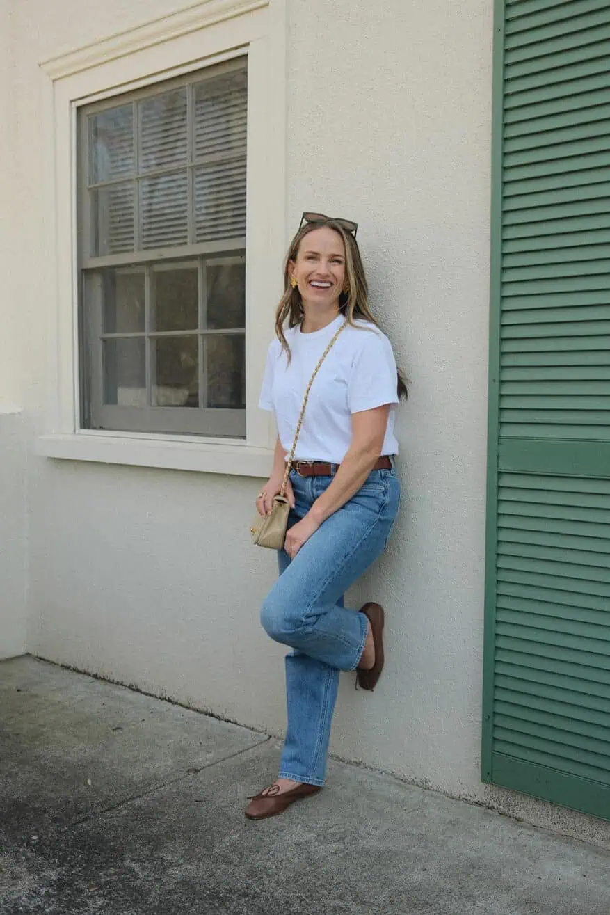 TeriLyn Adams in front of building with AYR straight leg jeans and ballet flats