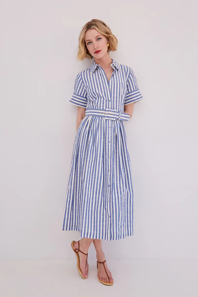 woman wearing striped blue and white belted seersucker dress