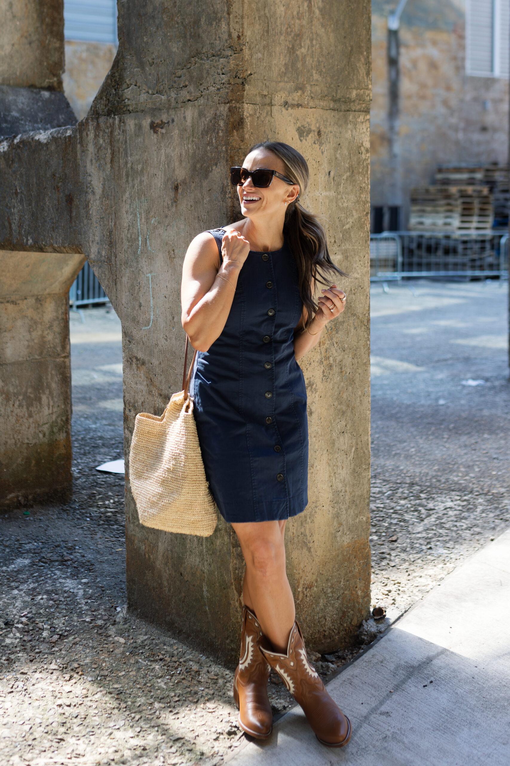 terilyn adams wearing tuckernuck navy chino dress and cowboy boots