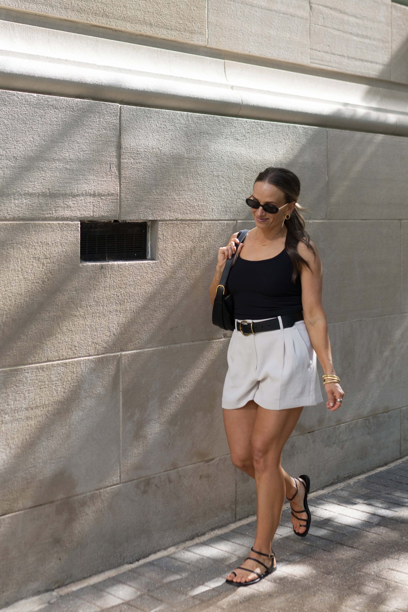 TeriLyn Adams wearing the Abercrombie Bra-Free Rib Scoopneck Tank and Trouser Shorts with Positano Sandals