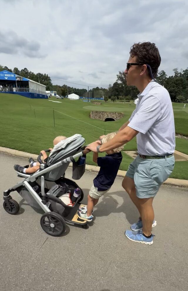 Tommy Adams pushing UppaBaby Vista stroller with piggy back board
