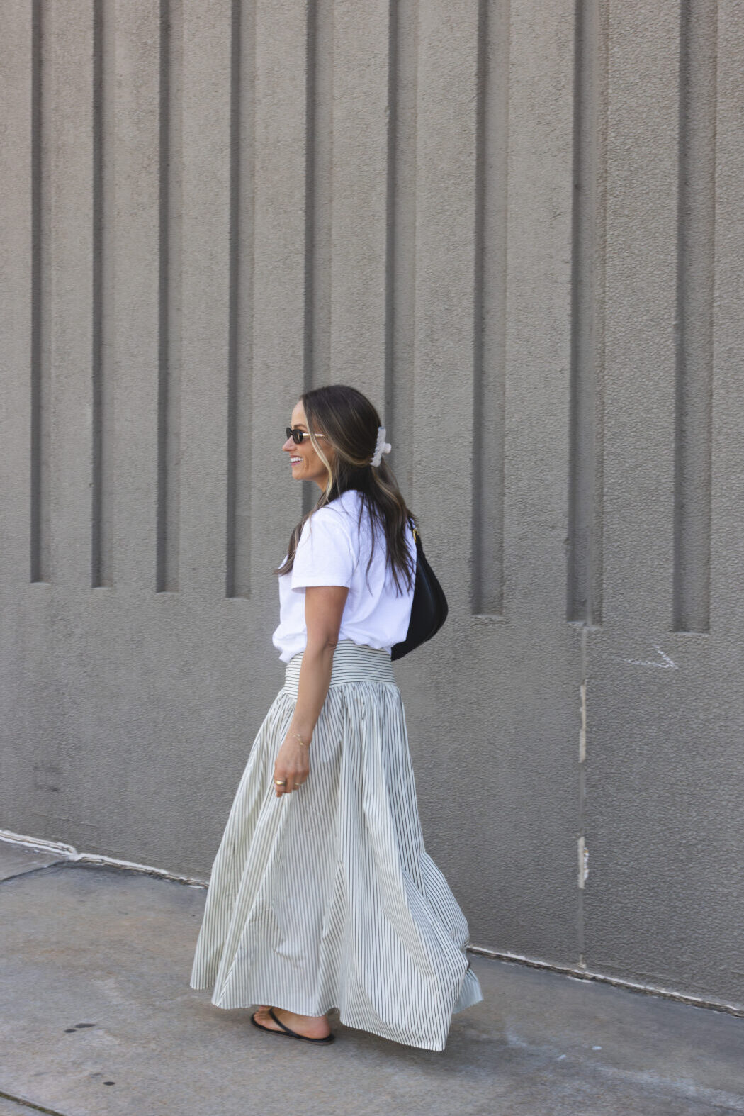 TeriLyn Adams wearing maxi skirt and white tee with sandals.