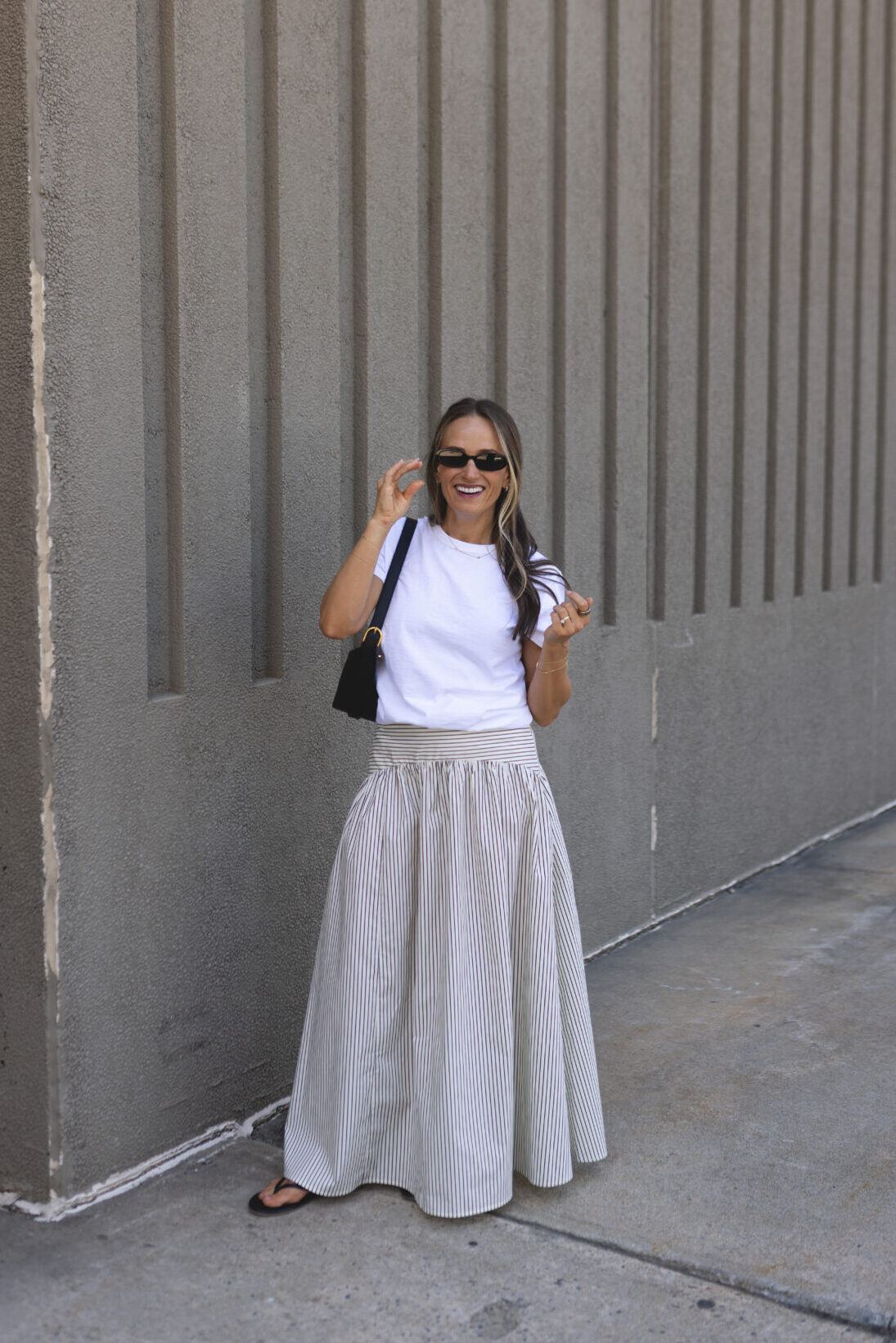 TeriLyn Adams wearing maxi skirt and white tee with sandals.