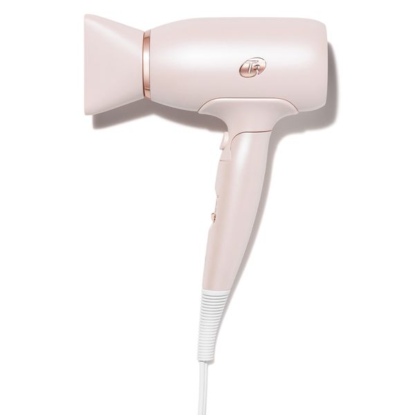 T3 travel hair dryer in blush pink with rose gold accents, product shot