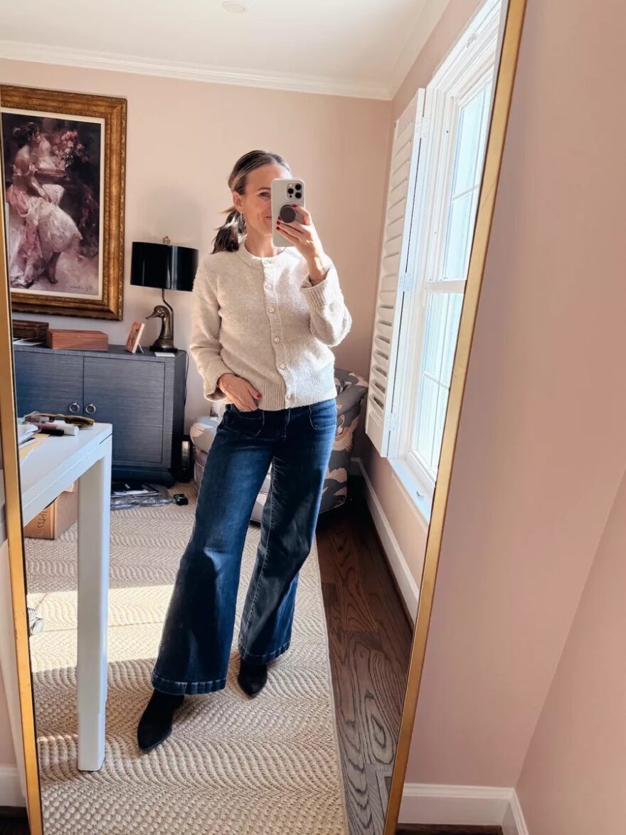 TeriLyn Adams wearing Kut from the Kloth Meg wide leg jeans with a cream cardigan