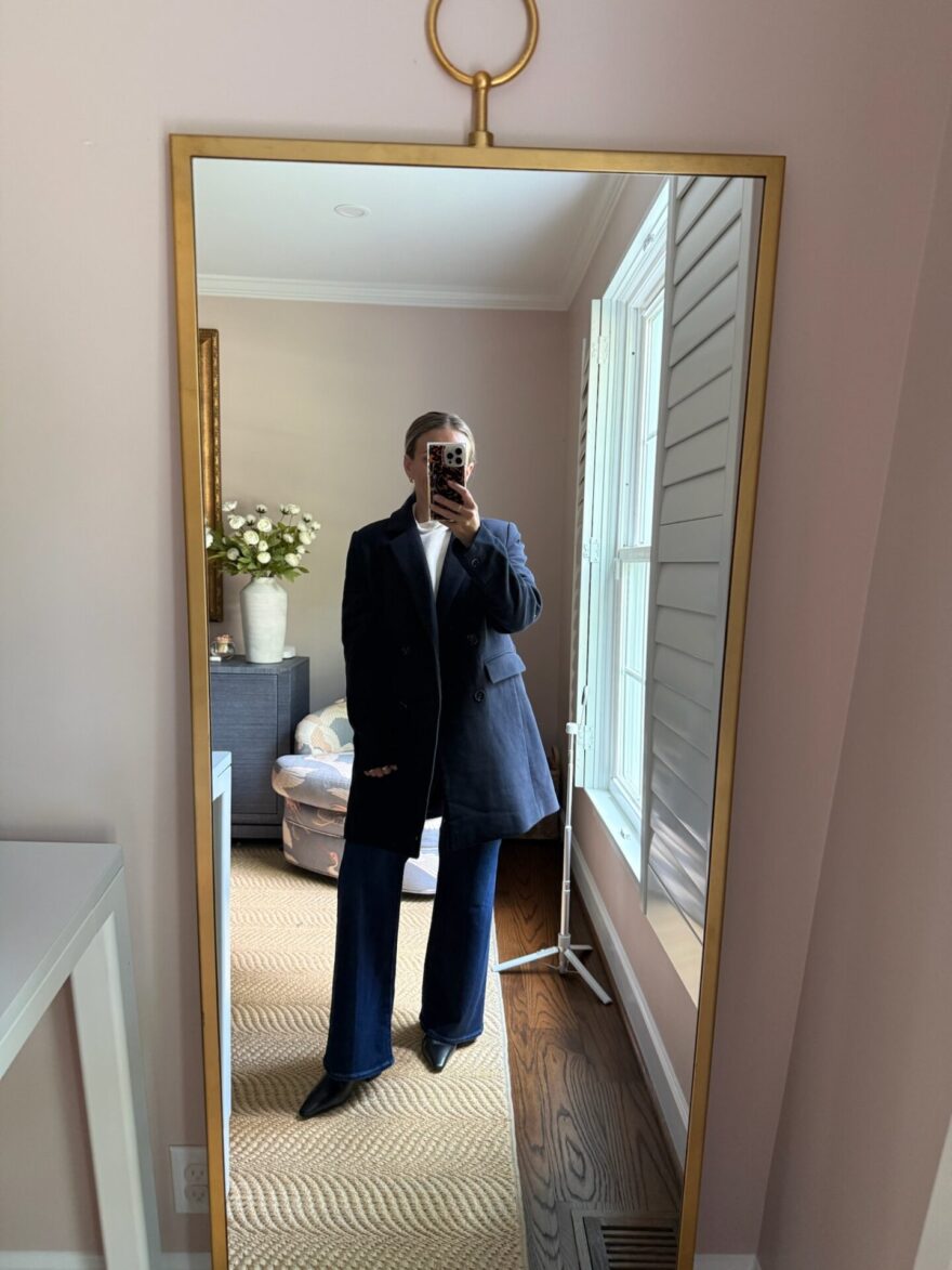 TeriLyn Adams wearing PAIGE Anessa wide leg jeans with a navy peacoat