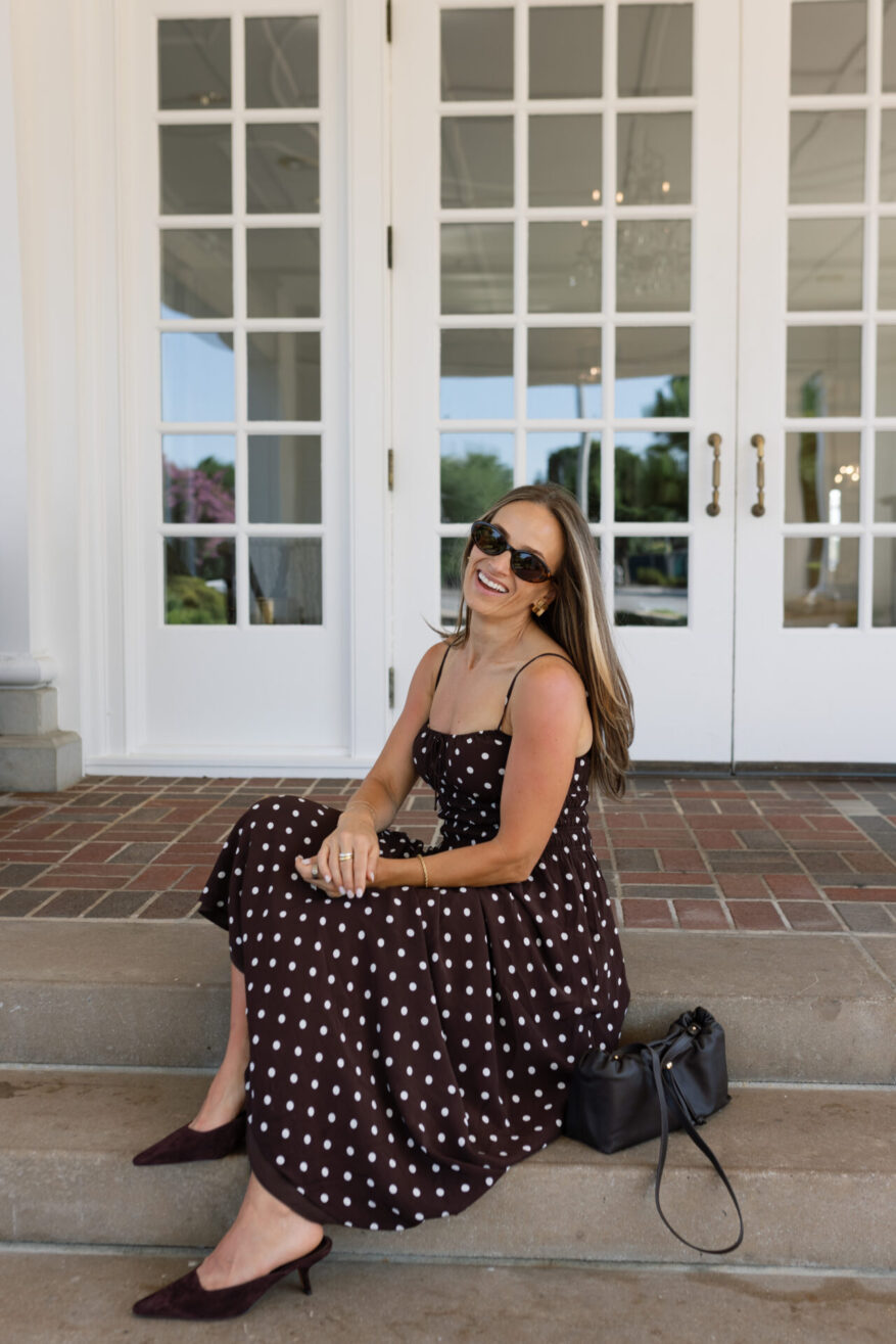 TeriLyn Adams wearing Sam Edelman Brandy mules with a brown polka dot midi dress