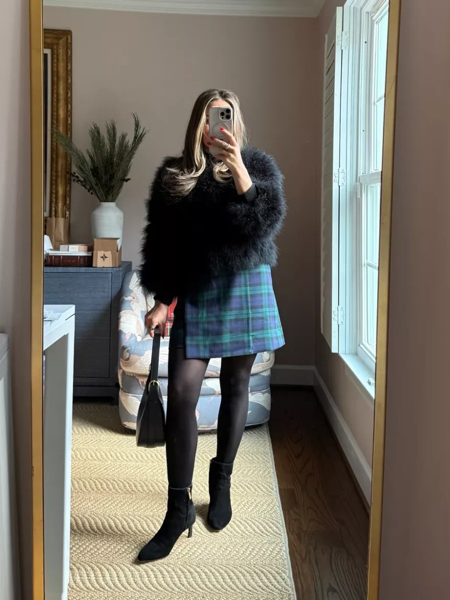 TeriLyn Adams wearing Veronica Beard Laidie kitten heel booties with a plaid mini skirt
