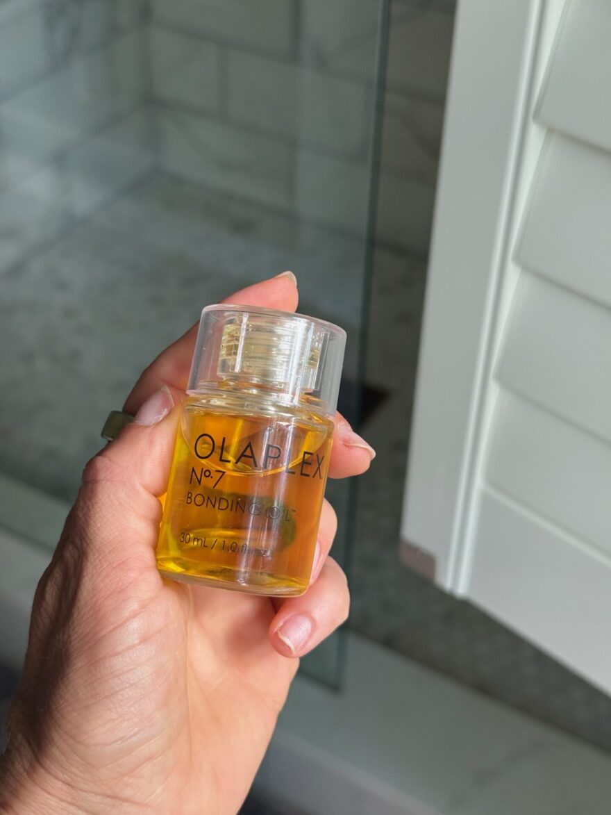 Olaplex No. 7 Bonding Oil held in hand, product shot