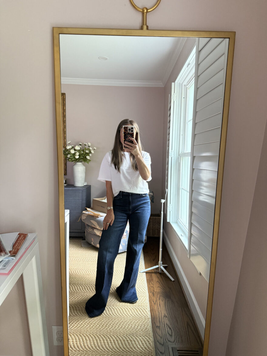 TeriLyn Adams wearing MOTHER Hustler Roller Sneak wide leg jeans in dark wash with a white tee