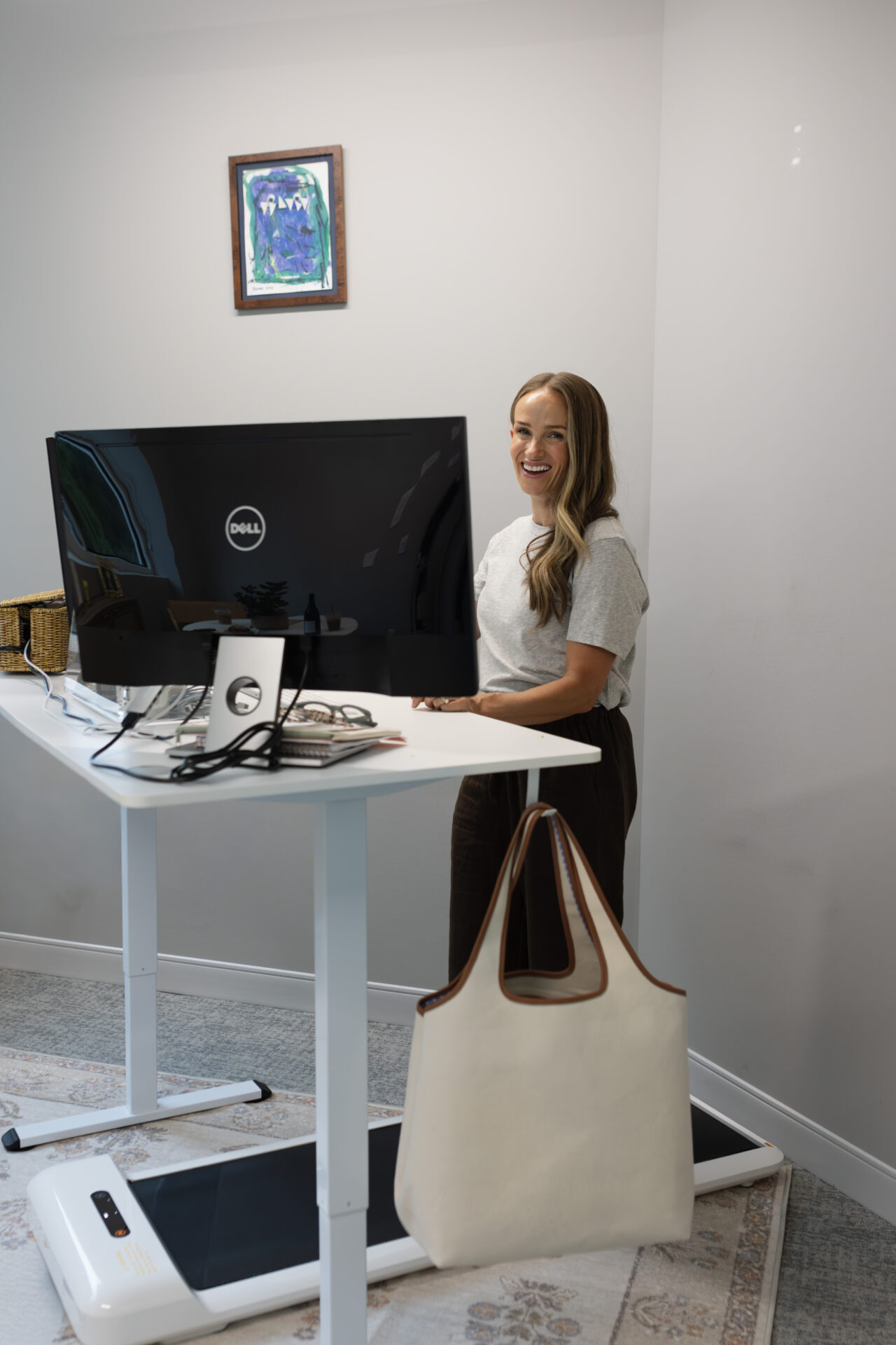 TeriLyn Adams with Cuyana System Beach tote hanging on walking desk.