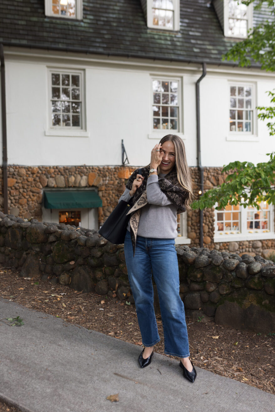 TeriLyn Adams wearing the Wild Rag scarf with gray sweater.