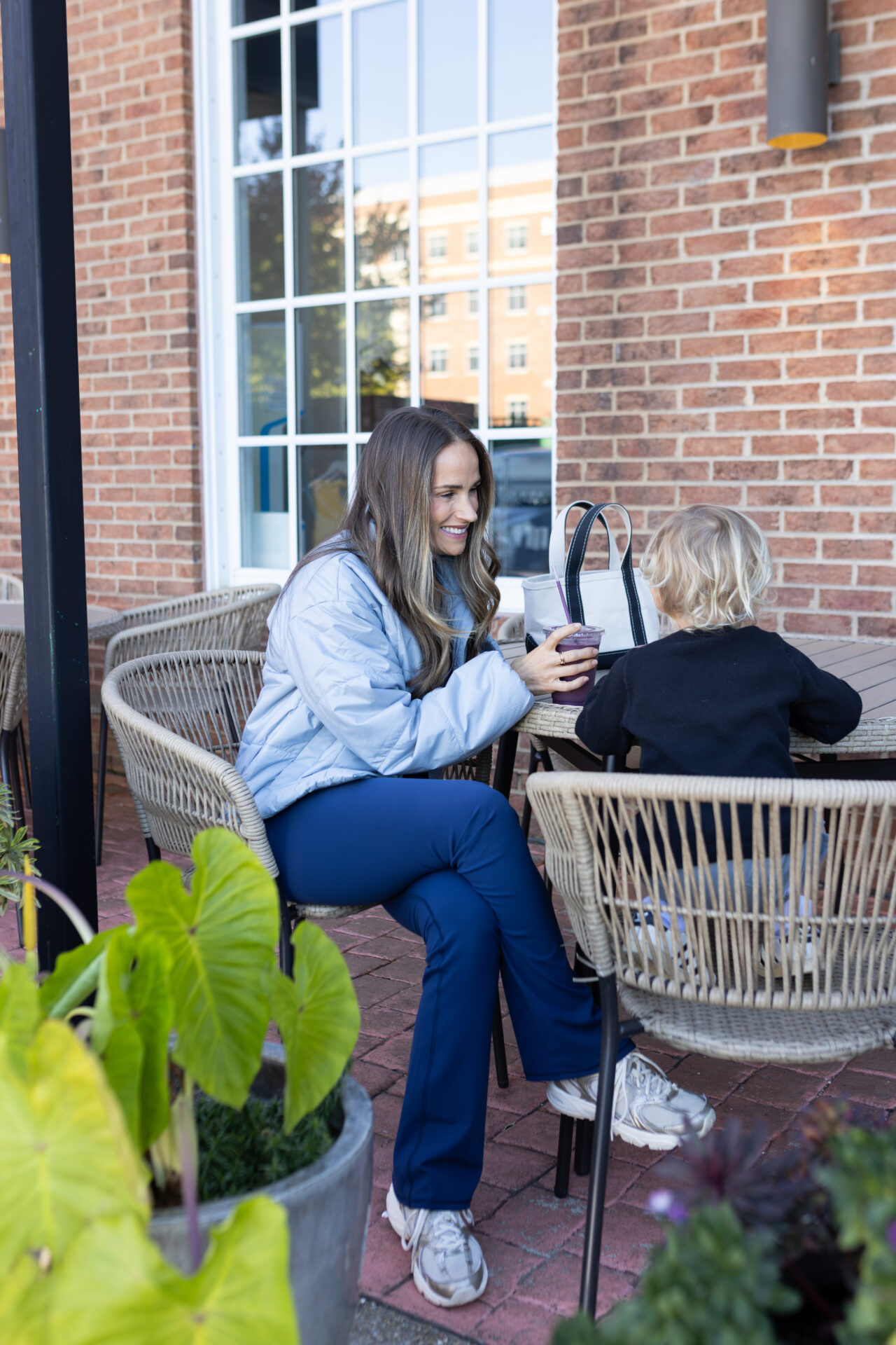 TeriLyn Adams wearing Vuori sporty coat and All the feels leggings.