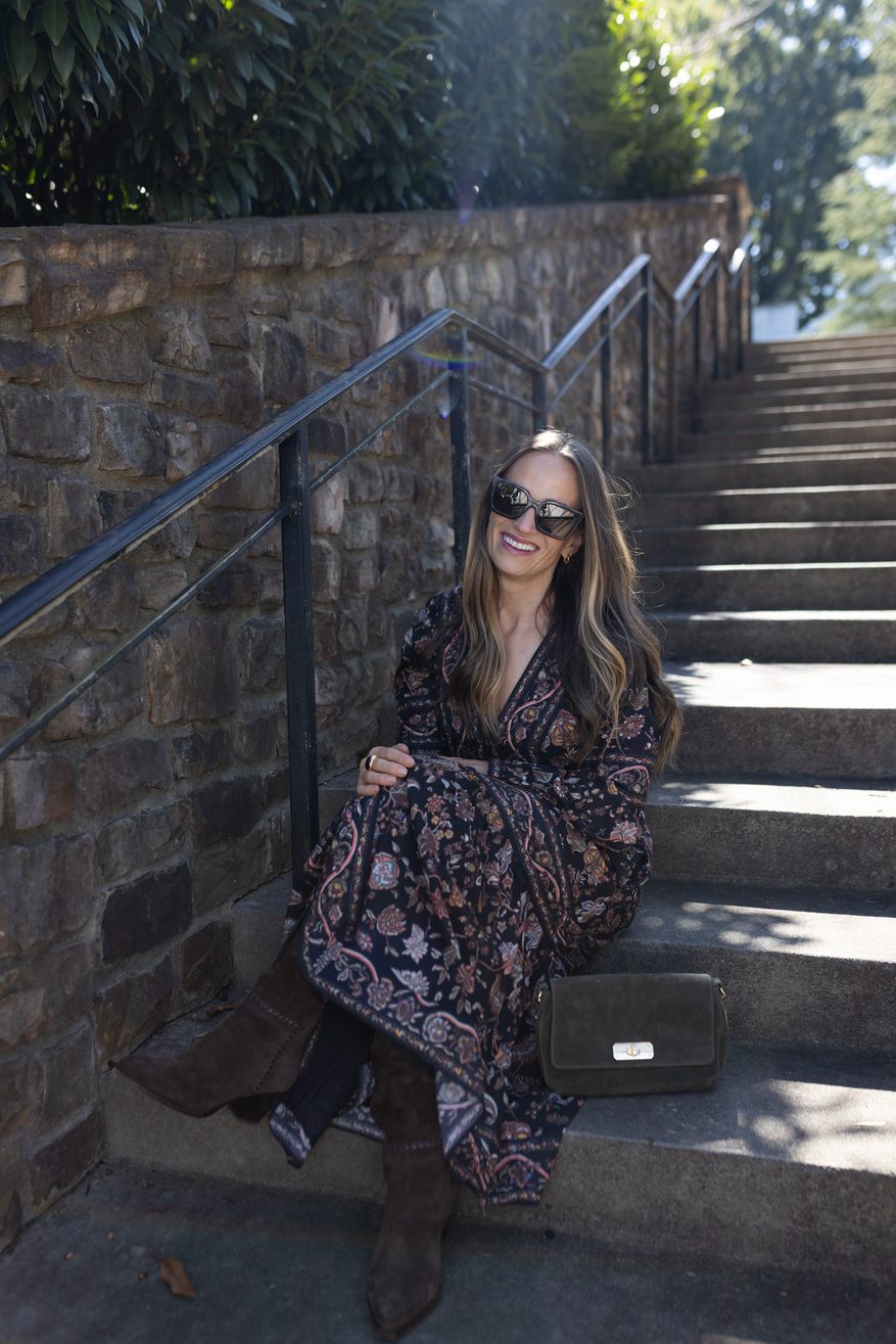 TeriLyn Adams sitting on steps wearing cleobella dress for fall capsule wardrobe style.