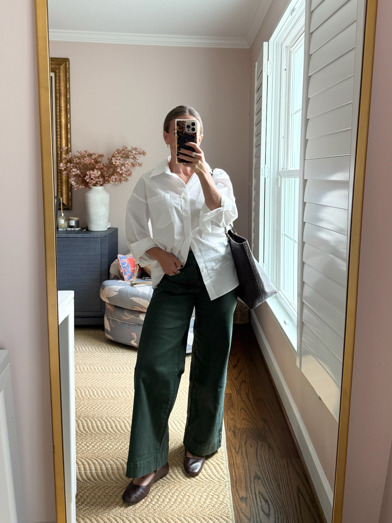 TeriLyn Adams wearing a white button up shirt with Olive Green pants for fall capsule outfit ideas.