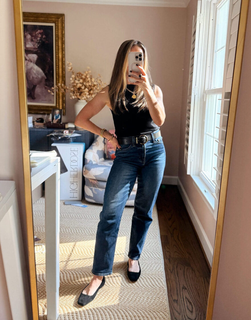 TeriLyn Adams wearing Pistola Issa straight-leg jeans with a black ribbed tank, black belt, and suede flats